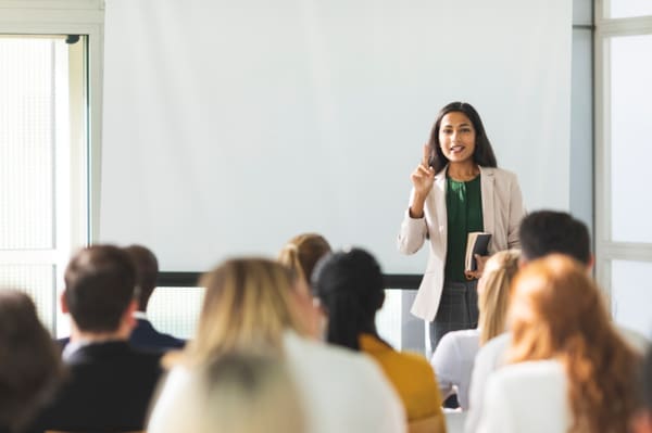 A group of business people attending a training in a meeting room