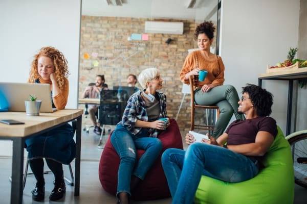 A group of college students studying and talking in a student union